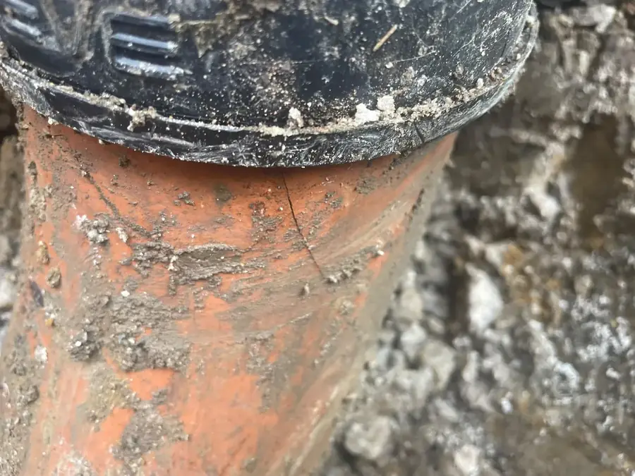 Close-up of the cracked rest bend pipe on Airdrie Crescent, Burnley