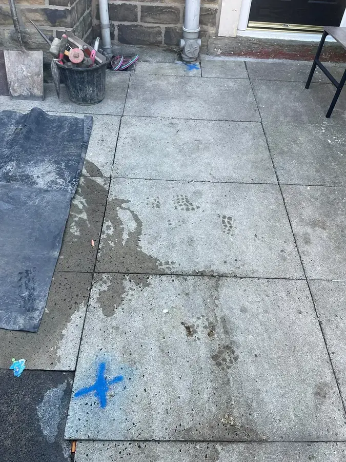 Waste water pooling on the patio before works on Albion Street, Padiham