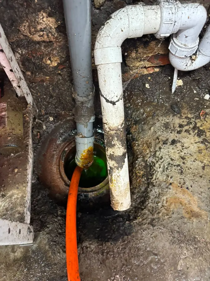 The external gully and pipework being flushed in Worsthorne