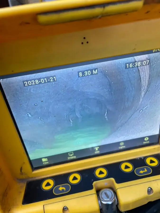 CCTV monitor showing the inside of the shared drain line during the survey