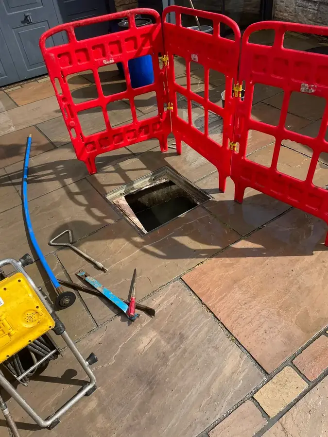 The manhole cordoned off during clearance on Clock House Avenue, Burnley