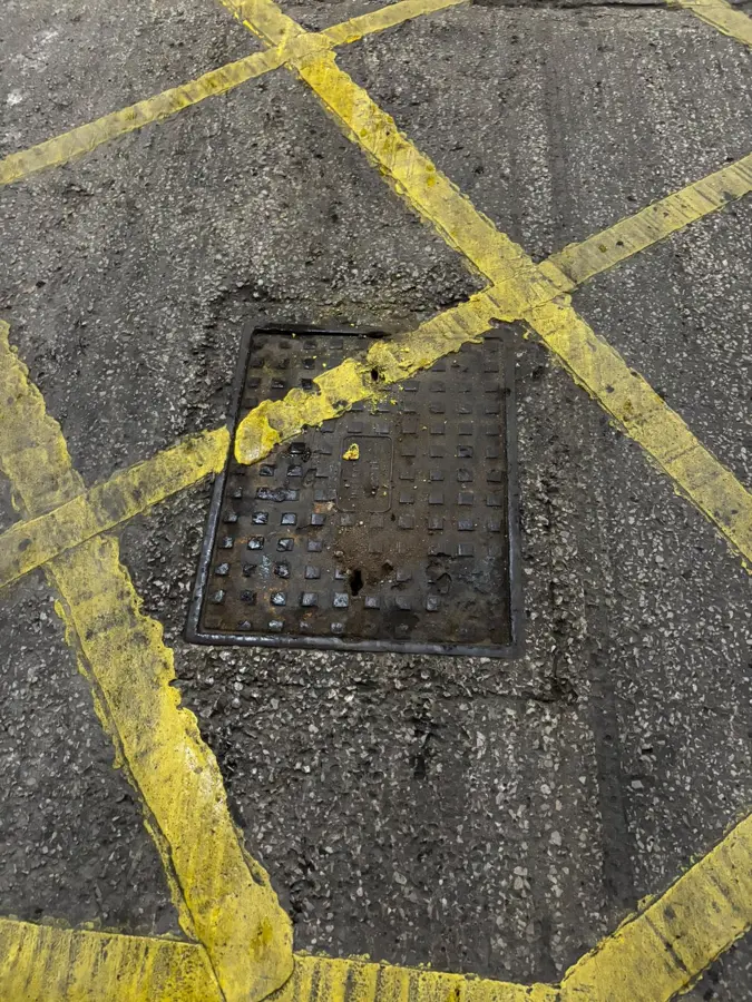 The yellow lined access cover at a food market in Burnley