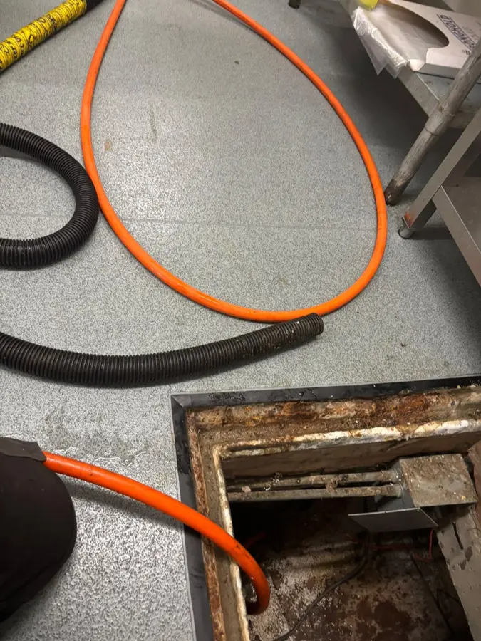 Jetting hose and cones at the loading bay access at a food hall in Burnley