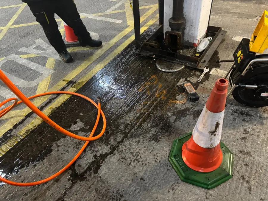 The access chamber with the jetting hose inside the food hall in Burnley