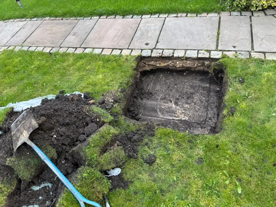 The manhole dug out of the lawn on Heckenhurst Avenue, Burnley