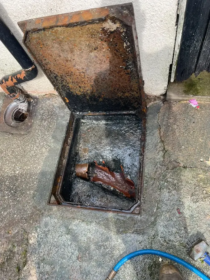 The open manhole showing the defective channel on Hufling Lane, Burnley