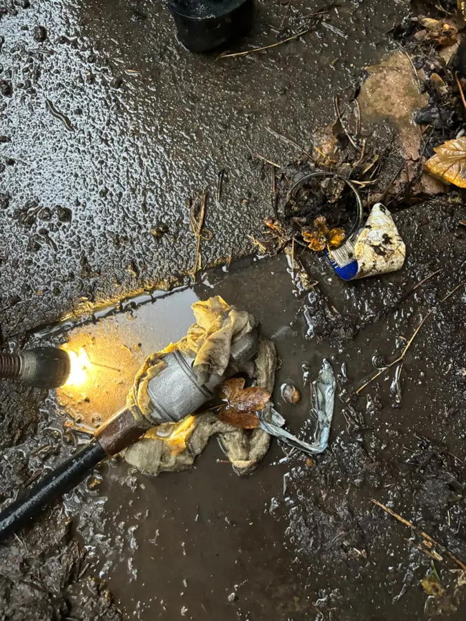 Debris and standing water around the gully on Hurstwood Avenue, Burnley