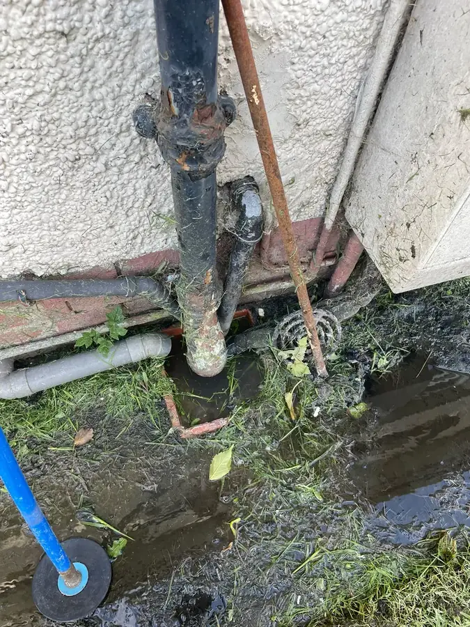 The blocked gully at the base of the downpipe on Leamington Avenue, Burnley