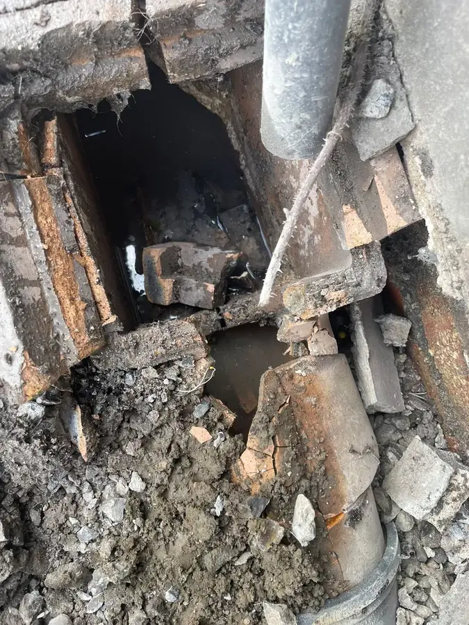 Close-up of the defective drainage being removed on Marine Avenue, Burnley