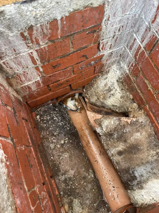 The blocked outlet in the manhole before clearance on Pendle Fields, Burnley