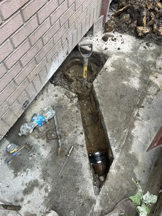 New drainage pipe installed in the excavated trench on Rome Avenue, Burnley