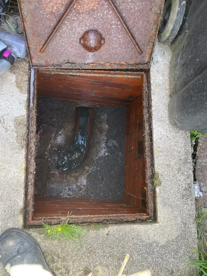 Water flowing freely through the chamber after jetting on Rydal Close, Padiham