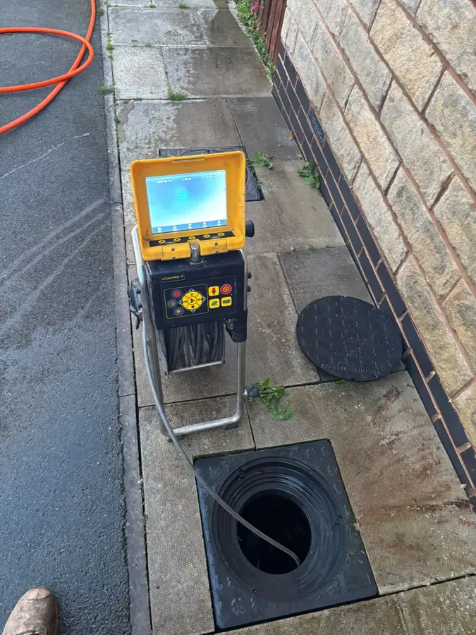 CCTV unit set up beside the manhole on Station Road, Padiham