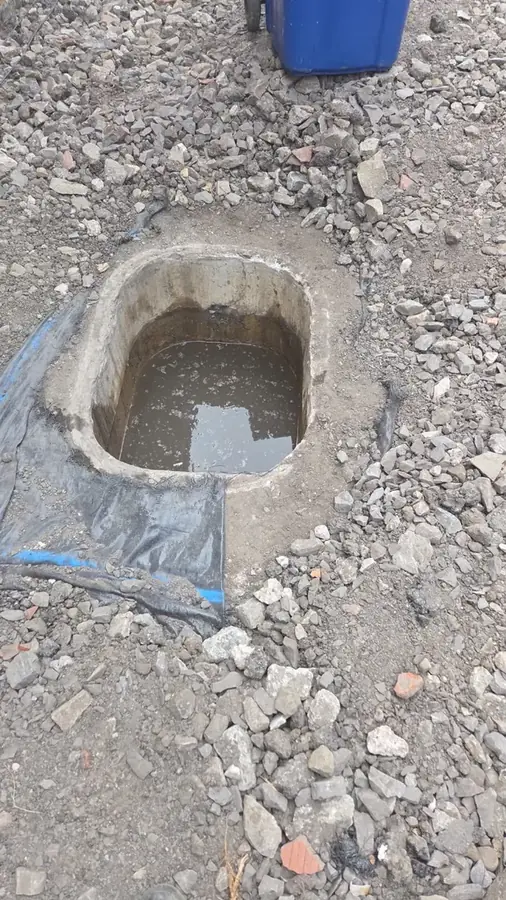 Chamber backed up with waste water before clearance on Trinity Close, Padiham