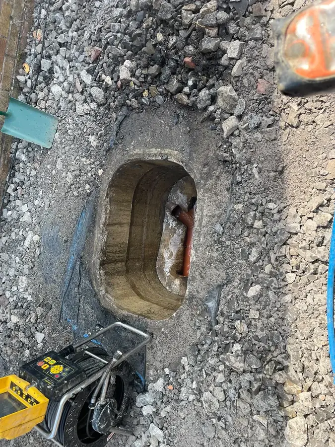 Cleared chamber with the water flowing away on Trinity Close, Padiham