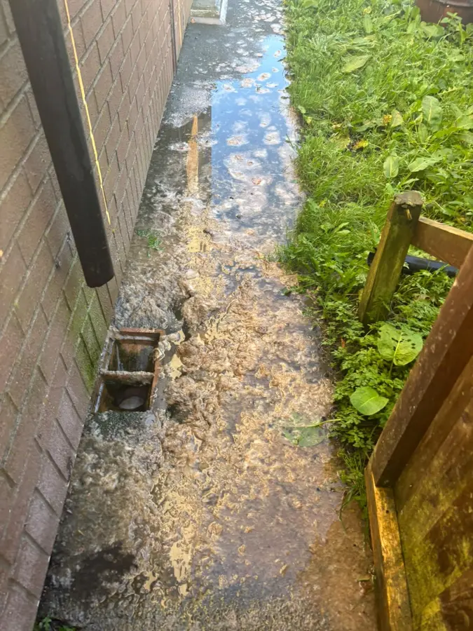 Standing water along the side path on Venice Avenue, Burnley