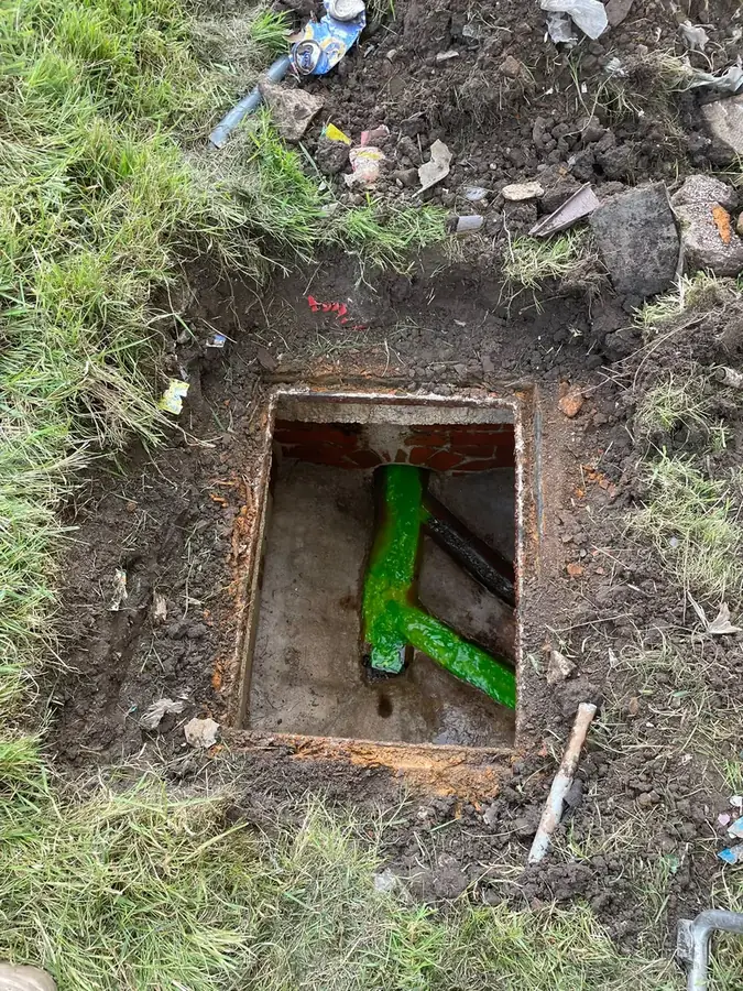Green dye flowing through the chamber confirming the line clear on Waddington Avenue