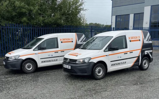 Complete Drain Services branded vans